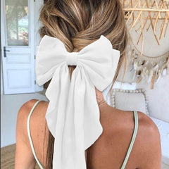 illpta bow in ponytail demonstrating volume and easy everyday styling