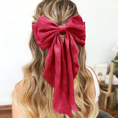 illpta red bow clipped on ponytail showing stylish uplift and stability benefit
