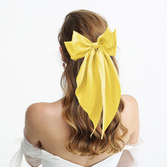 illpta satin bow close-up shows fabric texture and durable clip