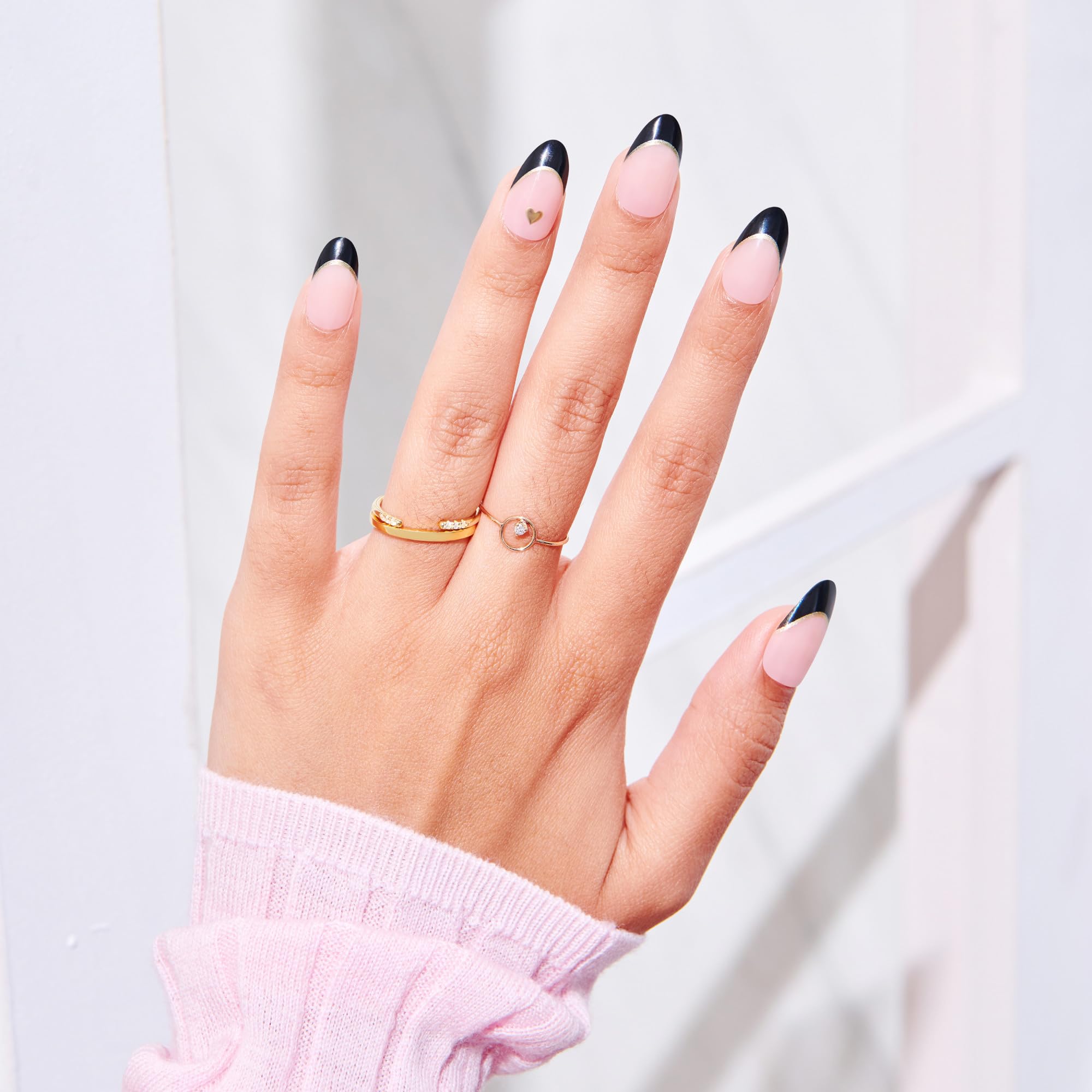 imPRESS hand applying a press-on nail showing quick easy application