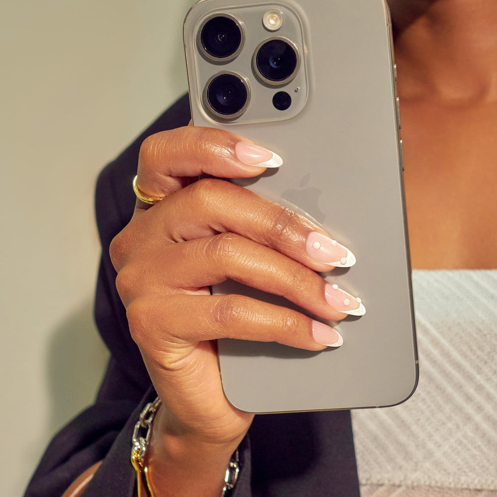 imPRESS close-up of nail finish highlighting smooth surface and crisp white color, salon look