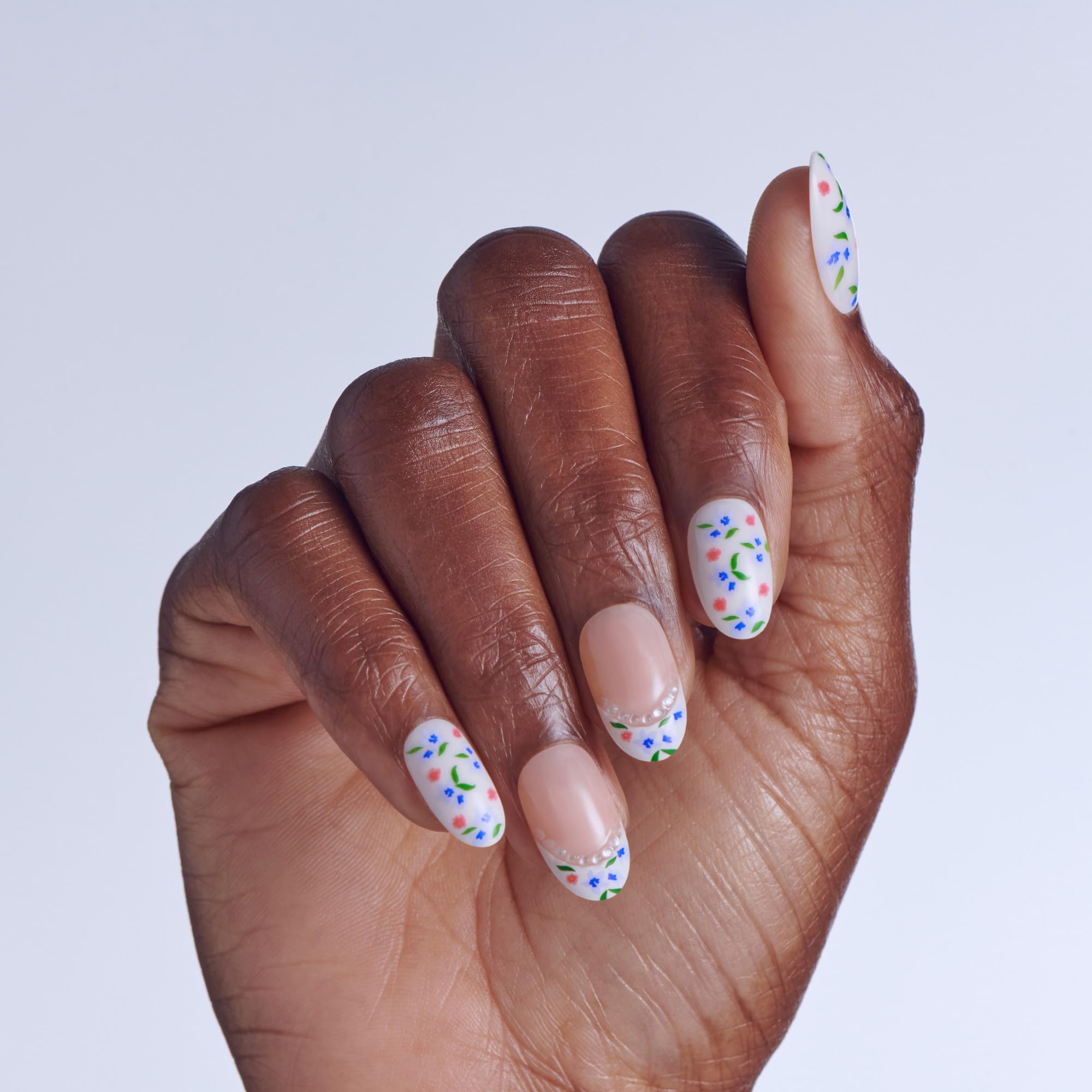 imPRESS arranged 30 nails display highlighting mixed floral and French-tip designs for variety