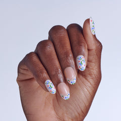 imPRESS arranged 30 nails display highlighting mixed floral and French-tip designs for variety