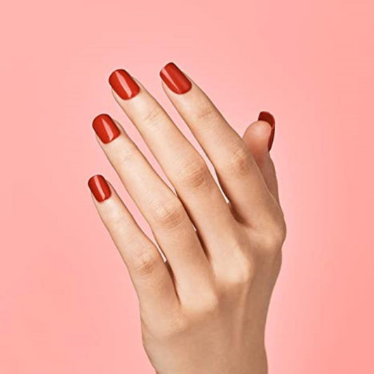 imPRESS close-up of glossy red squoval nail showing gel-like finish and smooth surface
