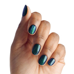 imPRESS on fingers beside a coin for scale to show realistic size and easy daily wear