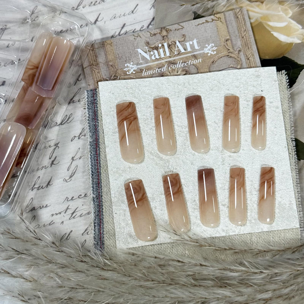 IMRAIN nails held in hand to show scale and length for choosing proper fit