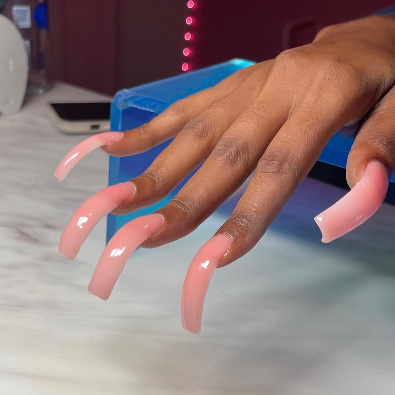 IMSOHOT nails in hand size comparison demonstrating extra-long square scale and wearable length