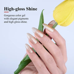 Imtiti brush applying champagne gold gel on nail swatch demonstrating smooth coverage