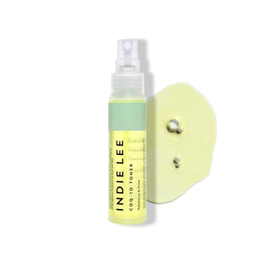 Indie Lee front bottle shot showing clear label and travel-friendly size