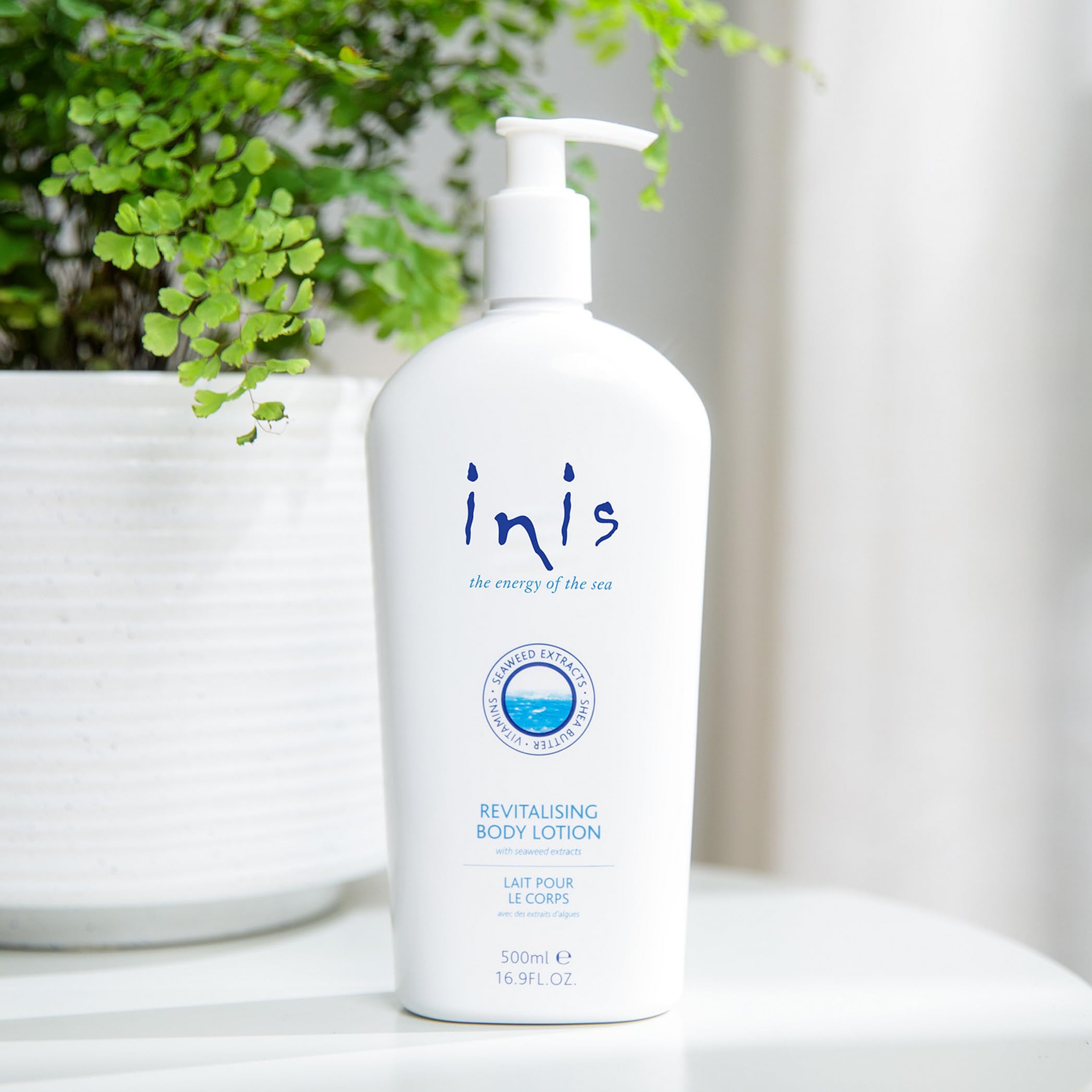 Inis lotion texture close-up highlighting creamy hydration and absorbency