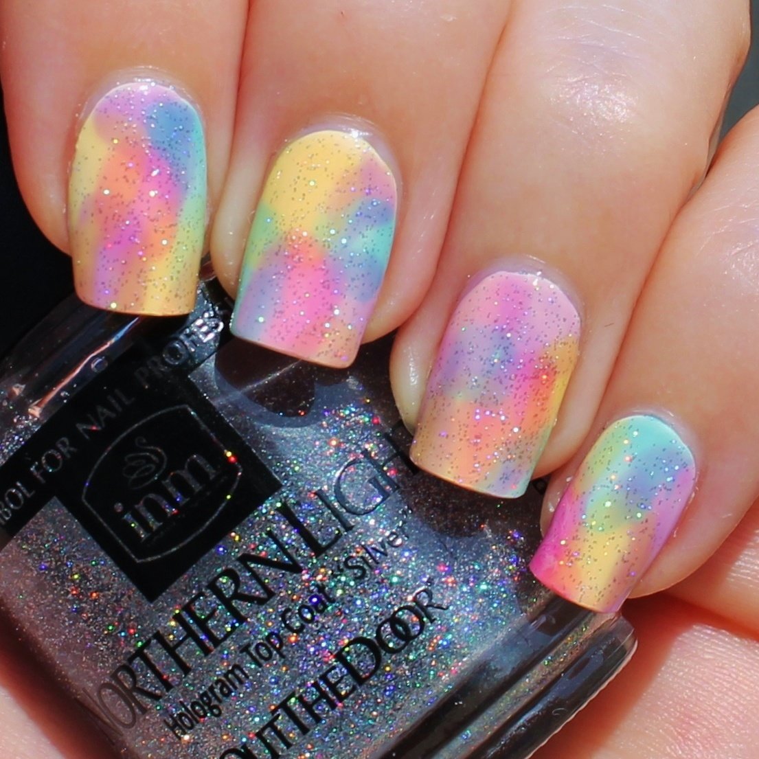 INM brush stroke close-up displaying micro-blended holographic particles for smooth shimmer