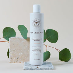 INNERSENSE bottle on bathroom shelf evoking clean, sustainable haircare routine