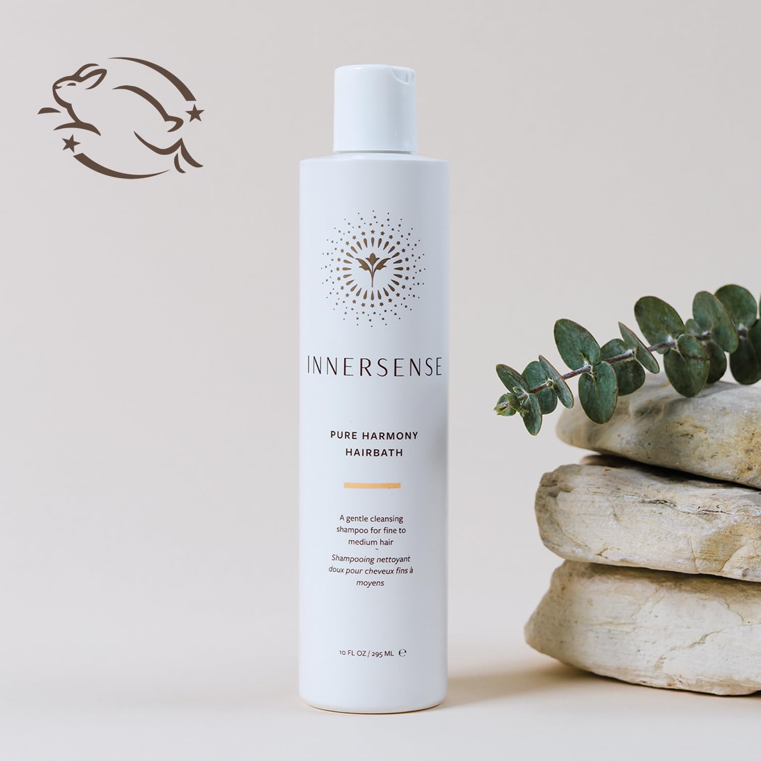 INNERSENSE creamy shampoo foam in hand demonstrating gentle lather