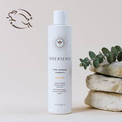INNERSENSE creamy shampoo foam in hand demonstrating gentle lather