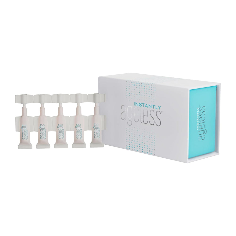 Instantly Ageless lifestyle mirror-ready model using product pre-makeup for camera-ready skin