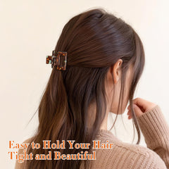 Interesse clip holding bangs back, showcasing discreet styling convenience