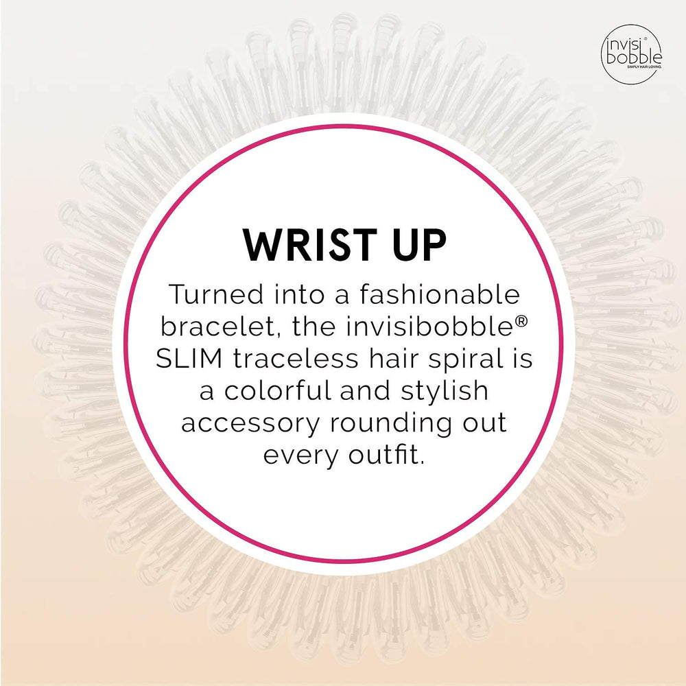 invisibobble held in hand to show slim size and portability for on-the-go styling