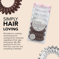 invisibobble beside a coin illustrating compact size and travel convenience