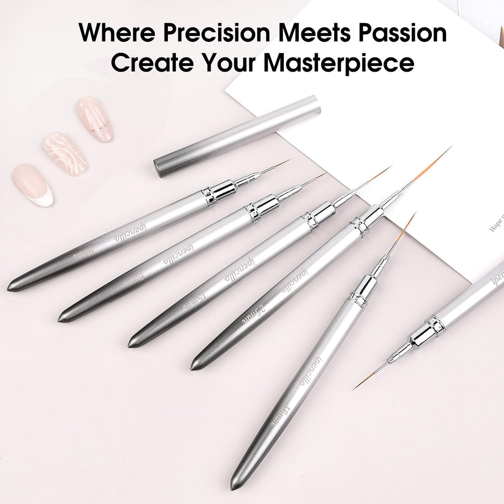 IPENCILLO brushes held between fingers to show scale and comfortable grip for detailed work