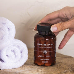 Isagenix bottle in wellness setting indicating supportive hair care