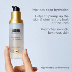 ISDIN bottle in hand to show travel-size scale and easy portability benefit