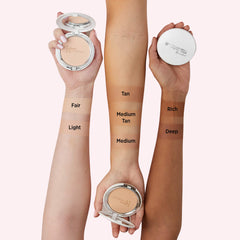 IT Cosmetics foundation being buffed with brush showing even application benefit