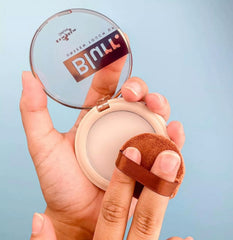 Italia Deluxe balm being dabbed on T-zone demonstrating oil control and seamless touch-up benefit