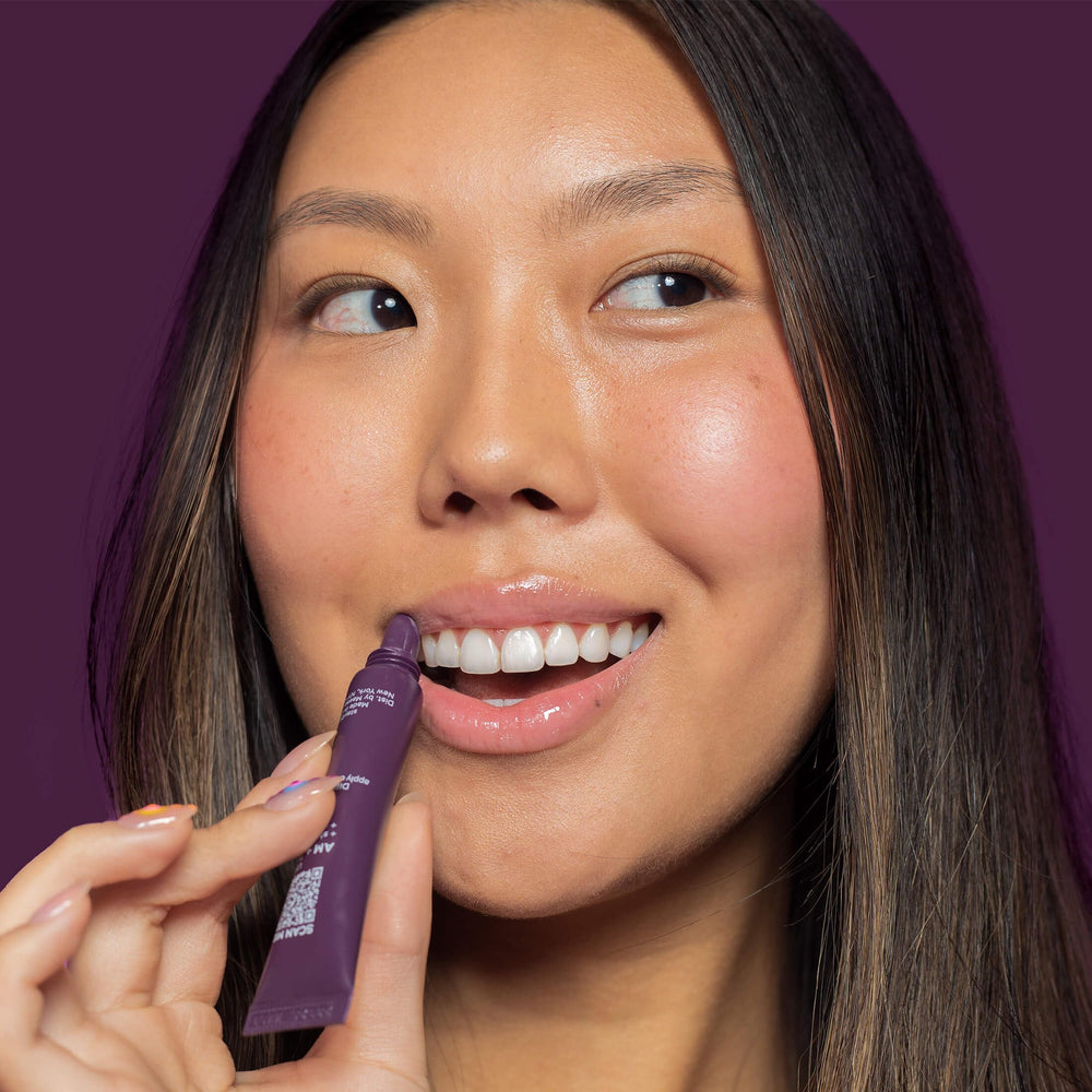 ITK lip balm close-up on lips highlighting clear glossy, moisturized finish