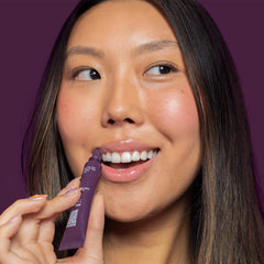 ITK lip balm close-up on lips highlighting clear glossy, moisturized finish