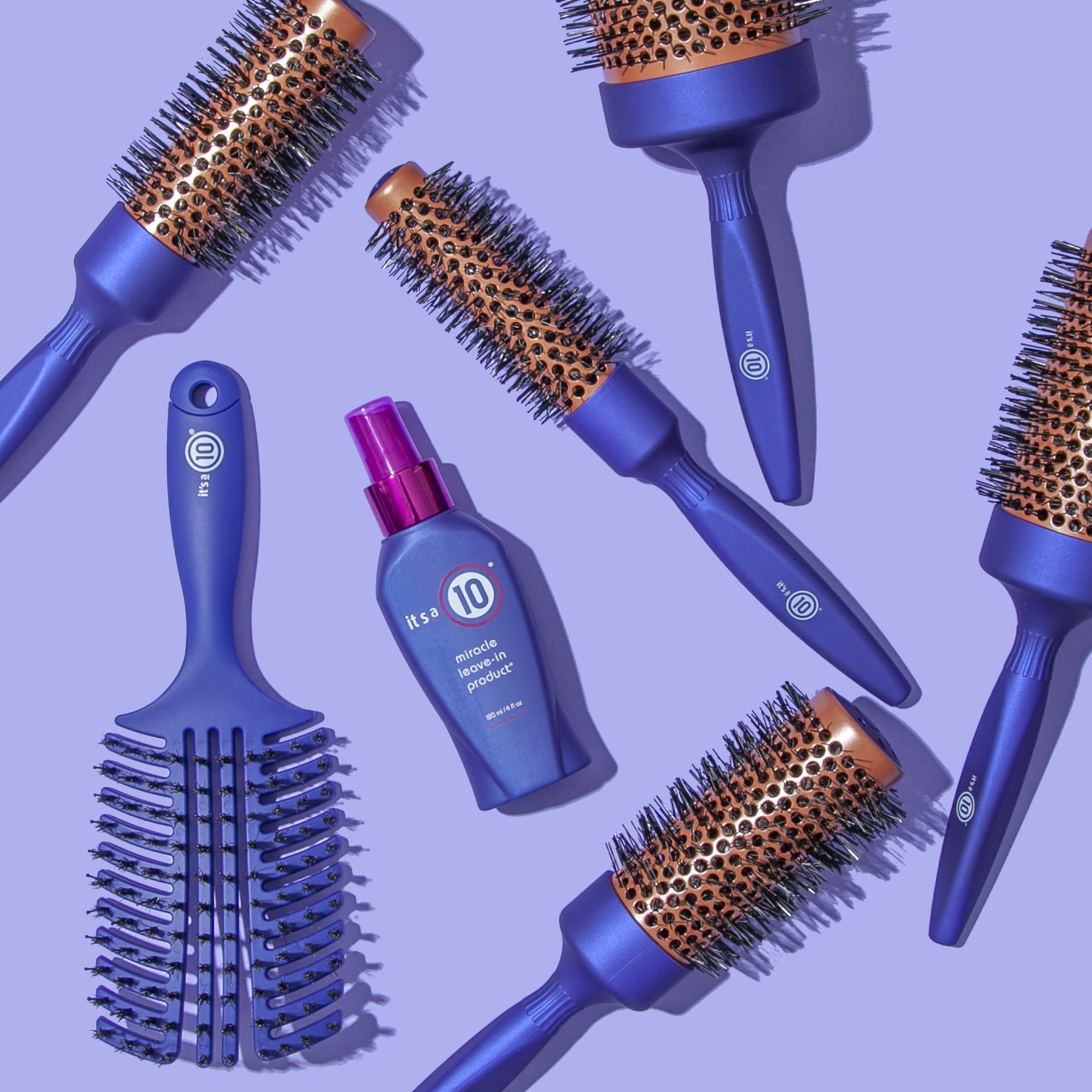 It's A 10 spritz in hand applying leave-in to damp hair for detangling benefit