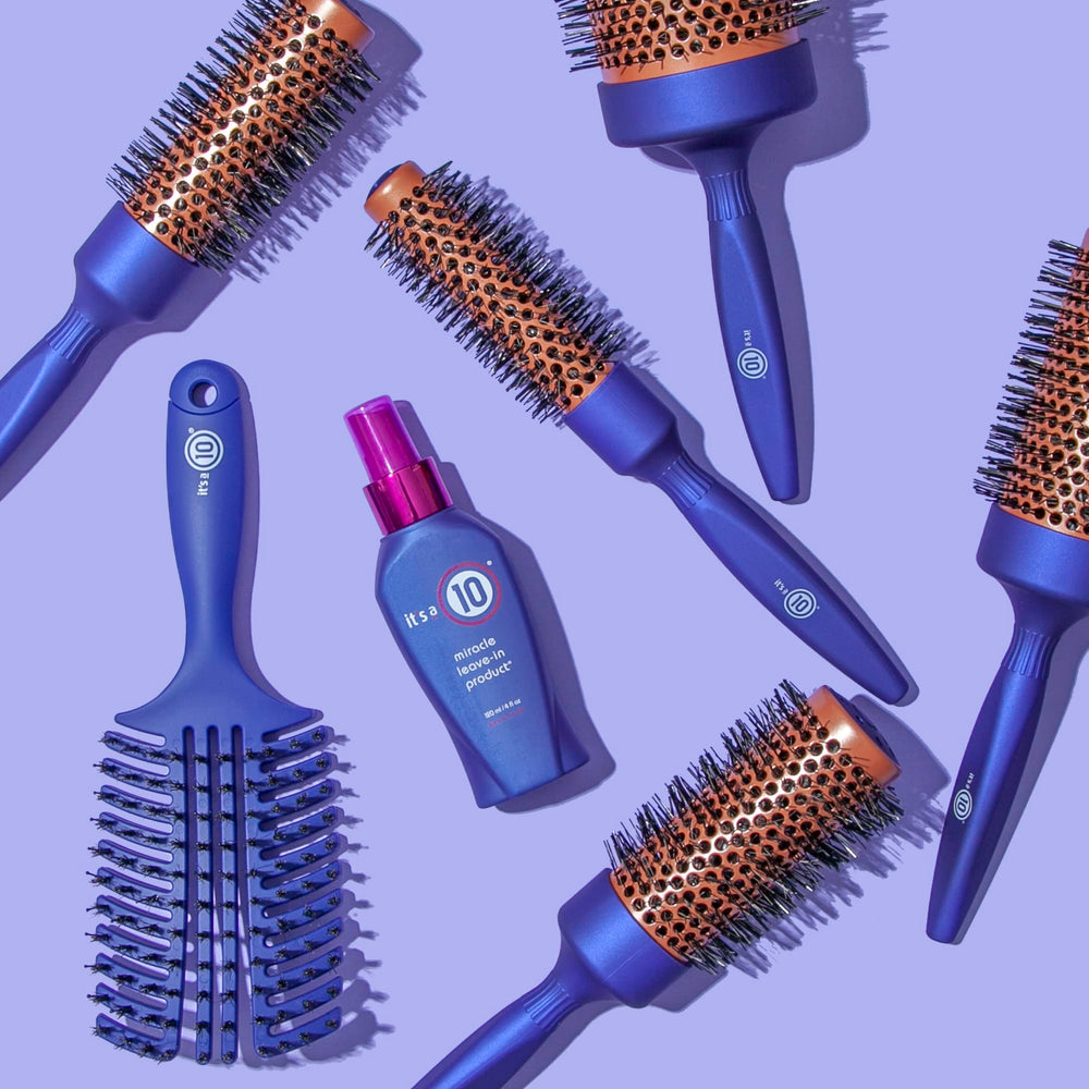 It's A 10 spritz in hand applying leave-in to damp hair for detangling benefit