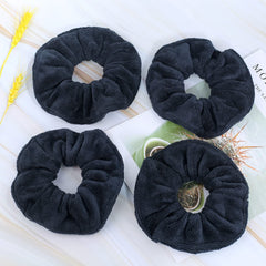 IVARYSS scrunchie in hand showing large 6-inch size for thick hair