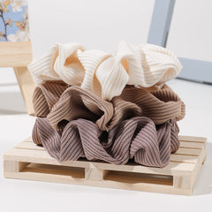 Ivyu scrunchie styling in a bun to showcase polished look