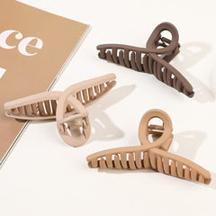 ivyu clip holding a high bun on curly hair, comfortable long wear