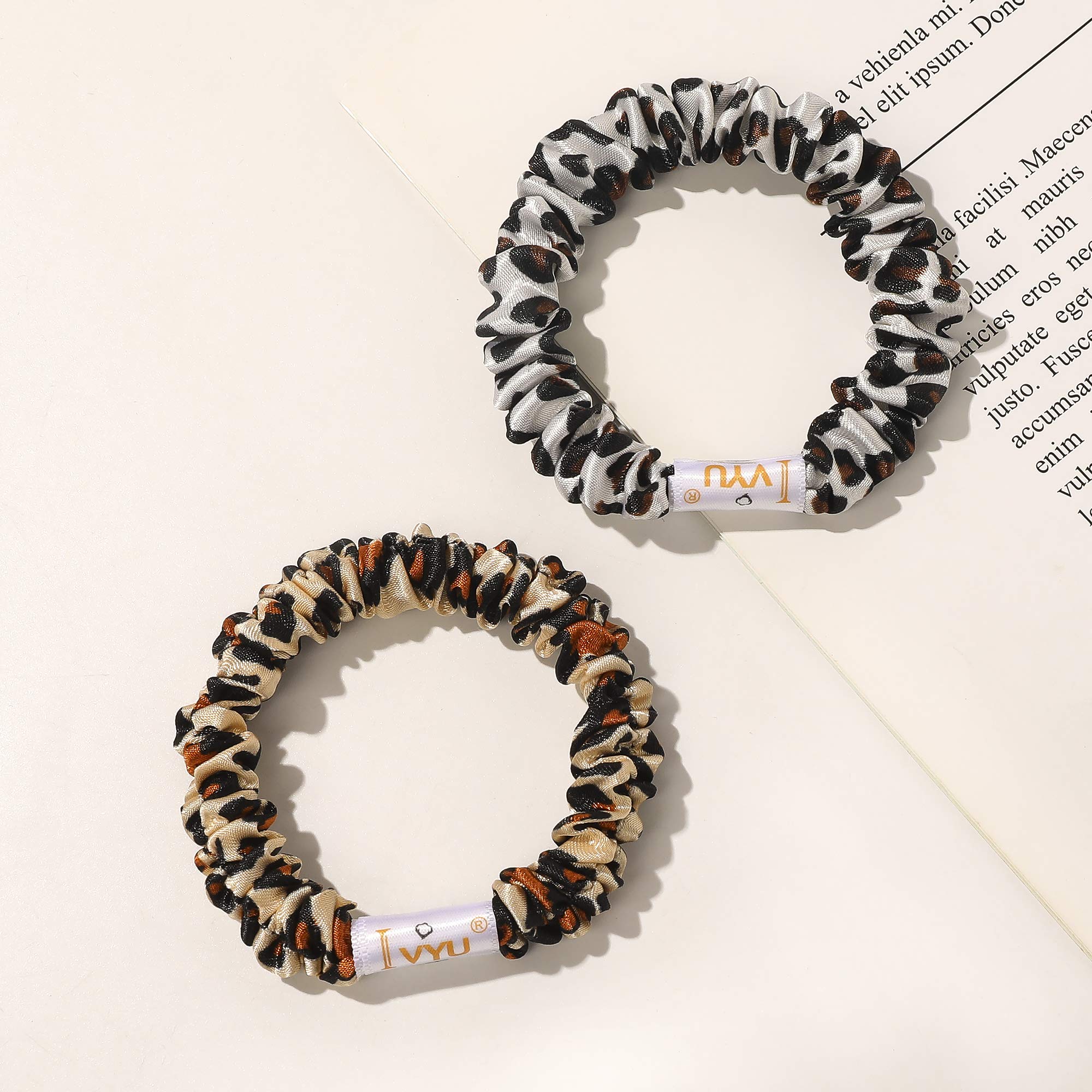 Ivyu scrunchie beside a coin showing compact size and travel convenience