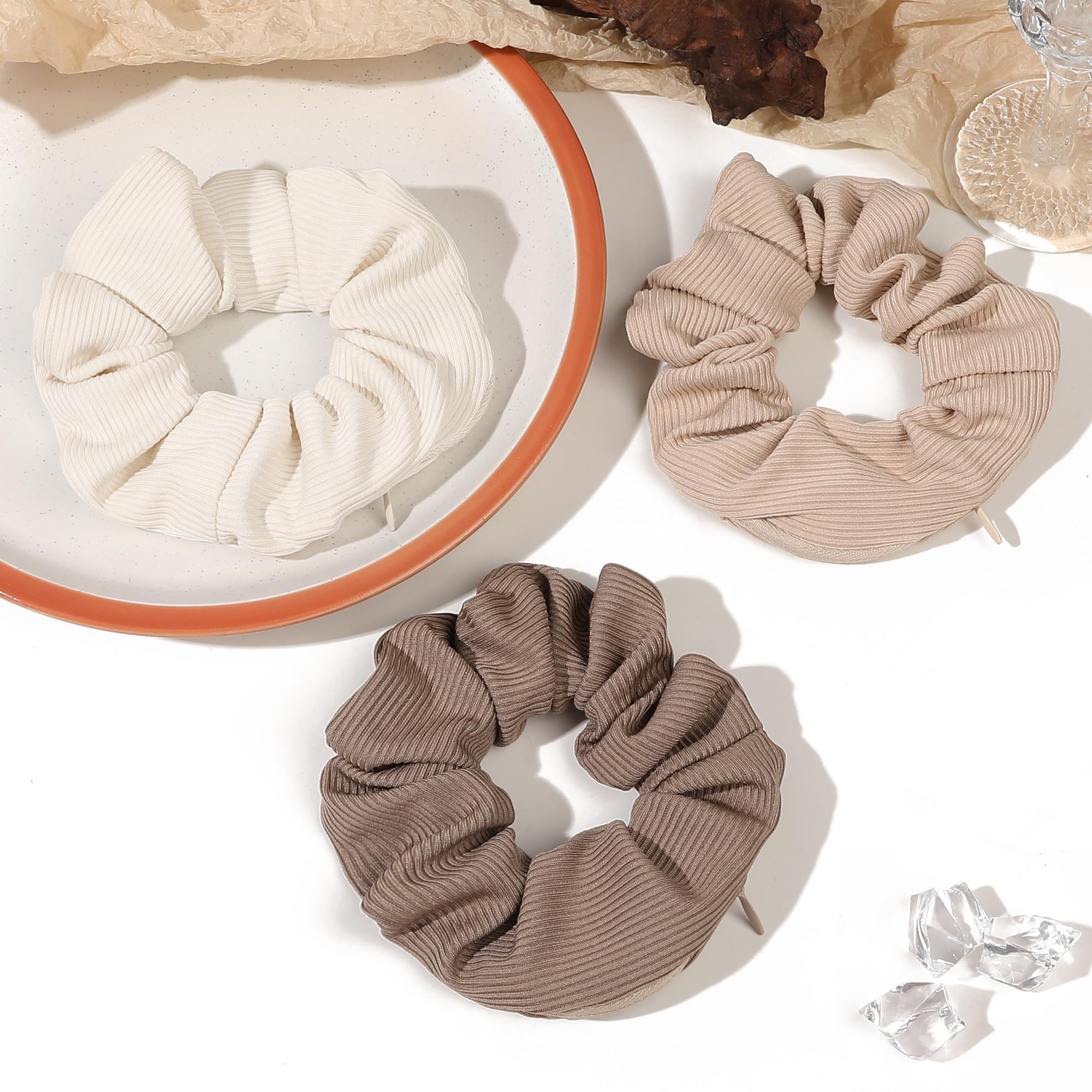 Ivyu scrunchie shown next to hand for size and scale clarity
