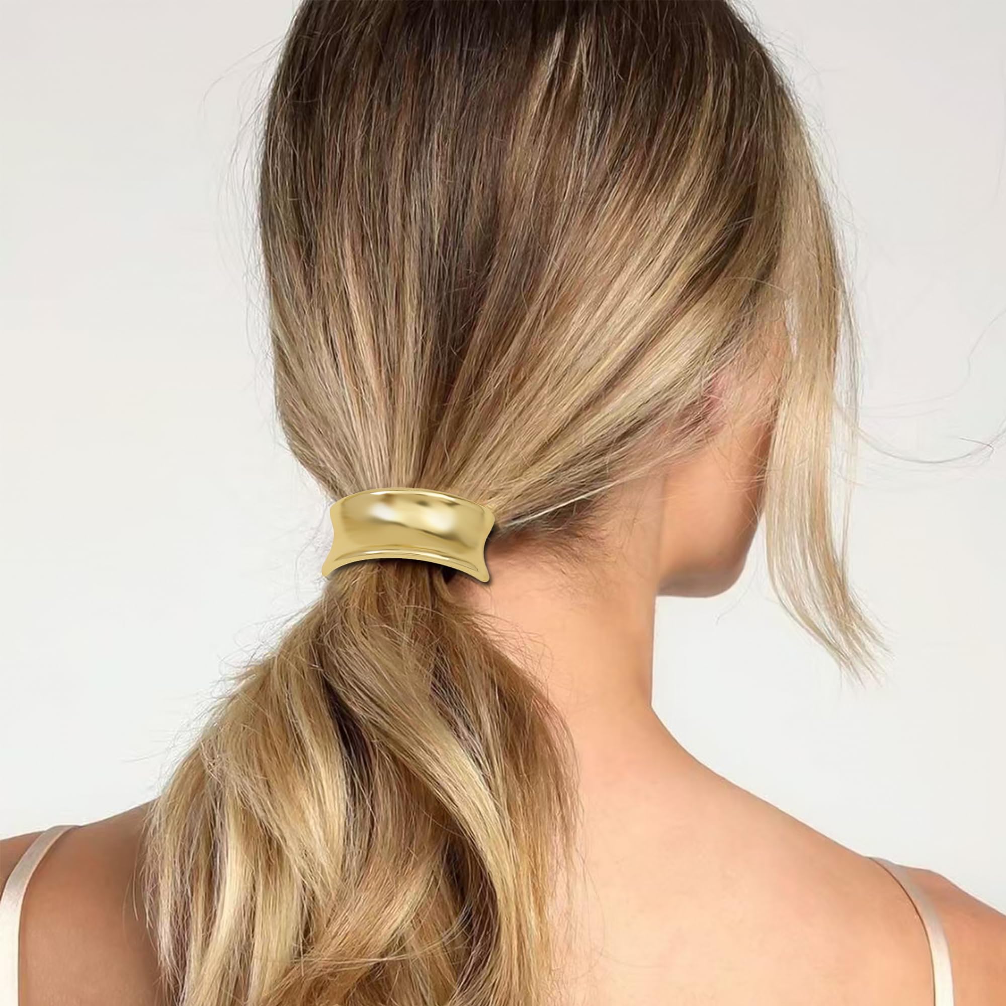 Ivyu hair tie beside a coin showing compact size and travel convenience