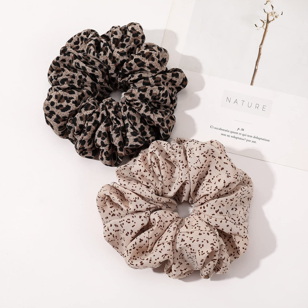 Ivyu scrunchie next to a hand to show large size and easy handling