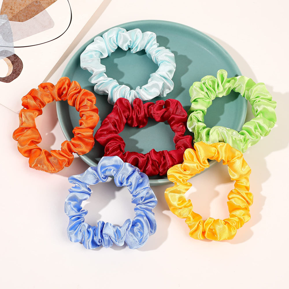 Ivyu scrunchie next to coin showing small compact size for travel