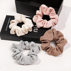 Ivyu scrunchie styled in a ponytail to show practical use