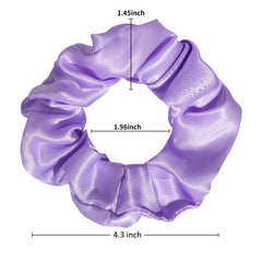 Jaciya scrunchie held in hand to show scale and easy portability