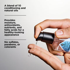 Jack Black bottle next to a razor and wallet showing compact travel-friendly size