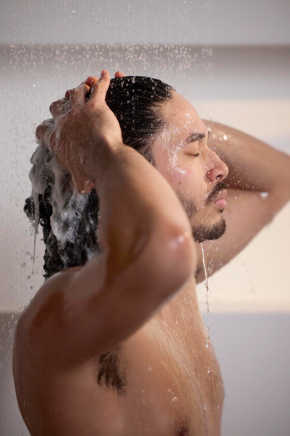 Jack Black turbo wash in shower demonstrating energizing use after workout
