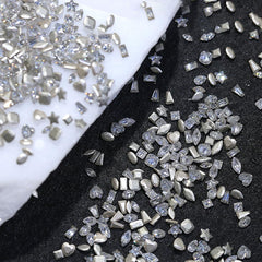 Jaliya rhinestones in hand showing 2–3mm scale for delicate nail art