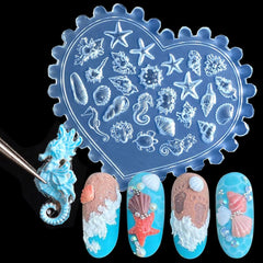 Jaliya single seashell finished charm beside mold, ready to glue for nail art