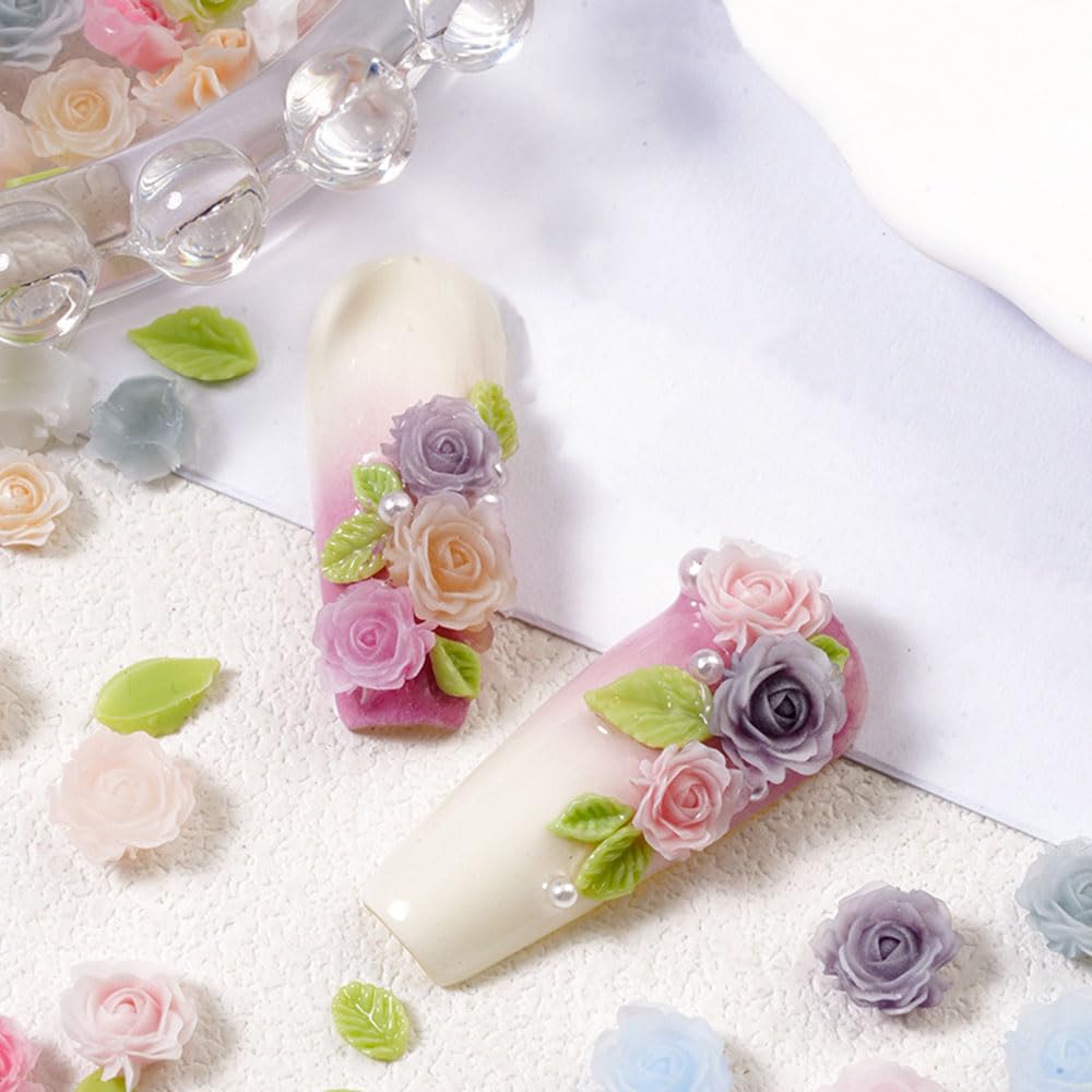 Jaliya charms displayed on a fingertip showing true scale for nails