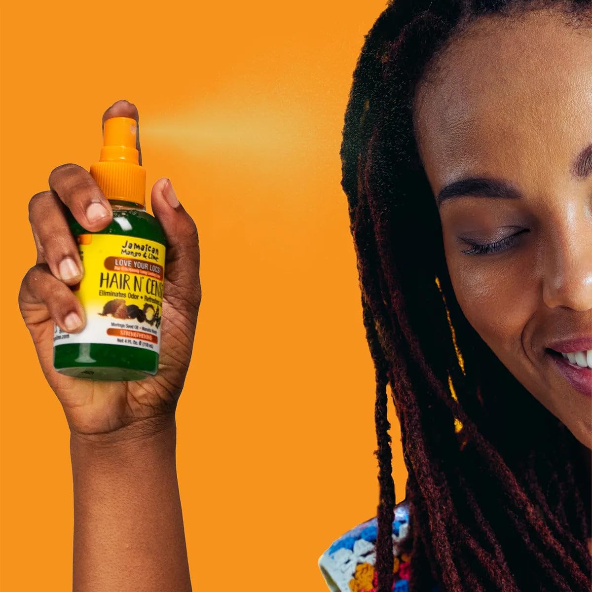 Jamaican Mango & Lime bottle held in hand shows 4 oz travel-friendly size