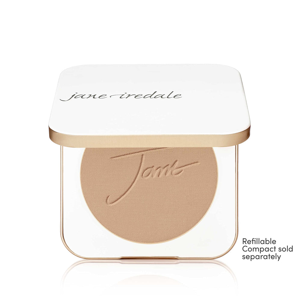 jane iredale kabuki brush applying product to show buildable coverage