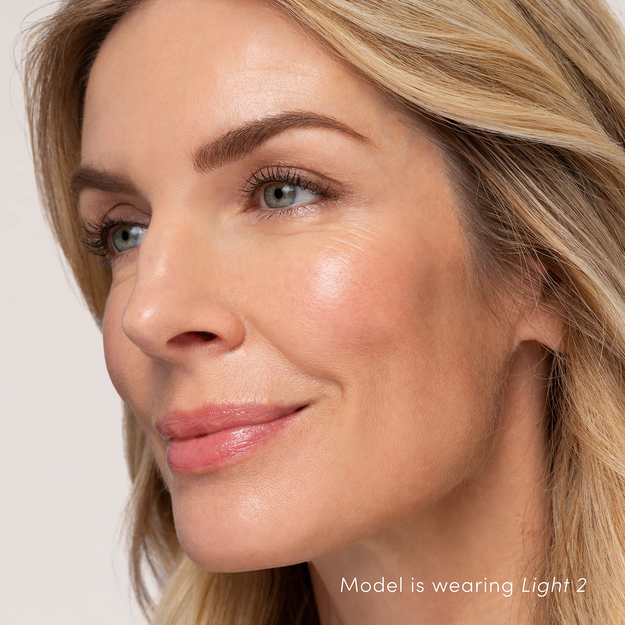 jane iredale product in hand for size scale and travel-friendly convenience benefit