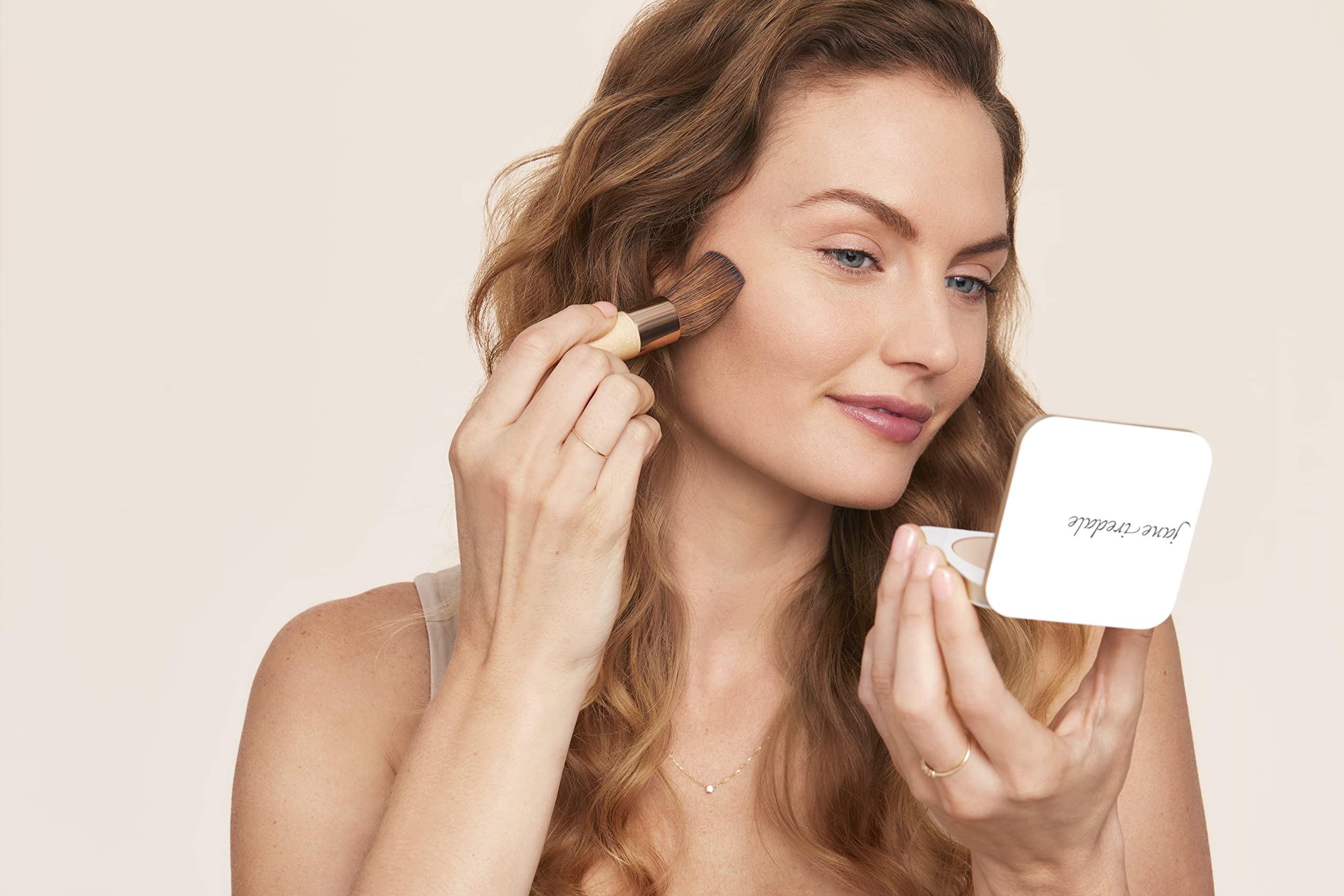 jane iredale arm swatch showing satin shade and natural finish benefit